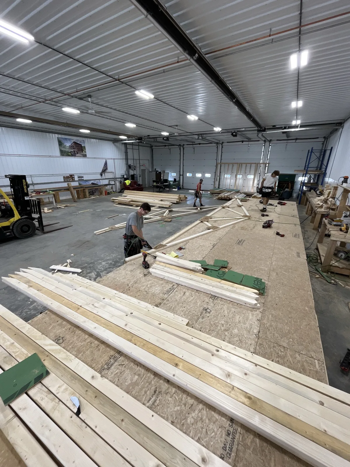 Crew building wall panels in the KCMC shop